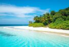 A scenic view of a beachfront with clear skies, vibrant colors, and no vehicles, emphasizing sustainable tourism.