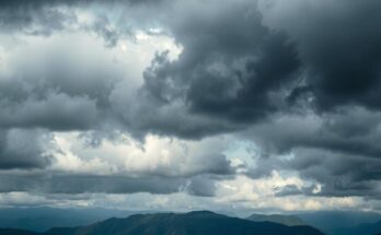 A darkened landscape with storm clouds and distant mountains, representing political tension and conflict in Ethiopia.